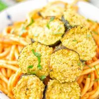 This Baked Zucchini Parmesan is entirely vegan, gluten free and will be a family favorite. Serve it with pasta, dips, as appetizer, dinner, lunches, meal preparation, or work lunch. Sprinkled with the best dairy free parmesan cheese that makes all the difference. Try it now. #vegan #dairyfree #vegetarian #contentednesscooking #dinner #lunch #mealprep #worklunchideas #zucchiniparmesan #zucchiniparmesanbaked #zucchiniparmesancrisps #comfortfood #kidfriendlydinners #familydinnerideas