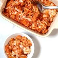 View of casserole dish and a serving on a small plate.