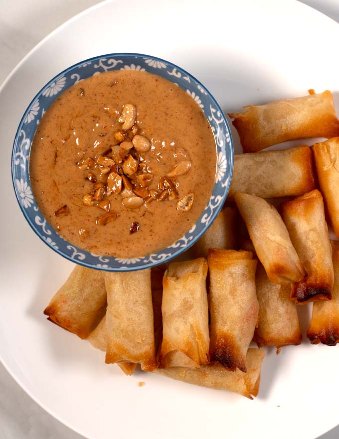 A top view of Vietnamese Peanut sauce served with spring rools.