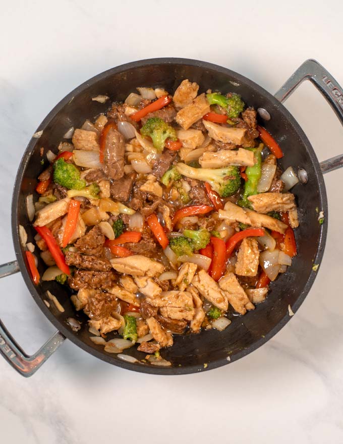 Top new of a pan with the Chicken and Steak Stir fry.