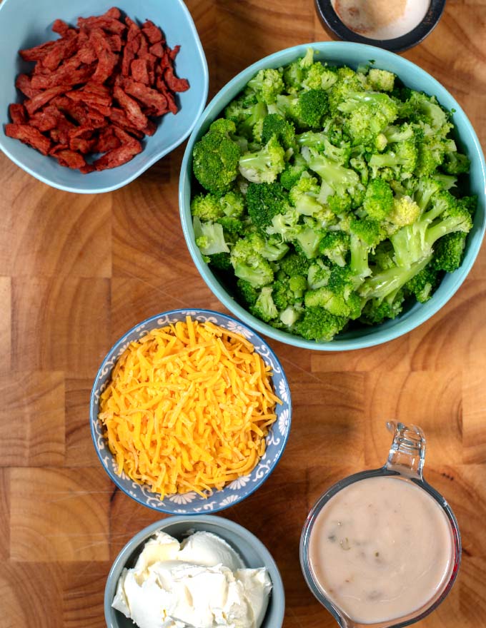 Ingredients needed for making Leftover Broccoli Casserole on a board.
