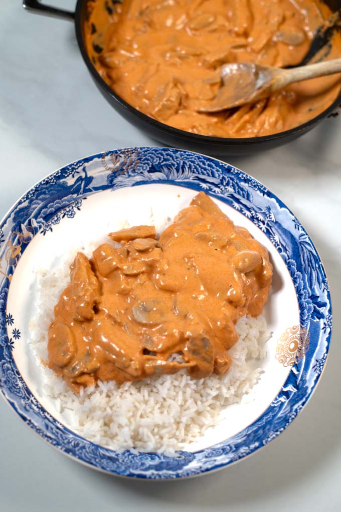 Closeup on a portion serving of Brazilian Stroganoff over white rice.