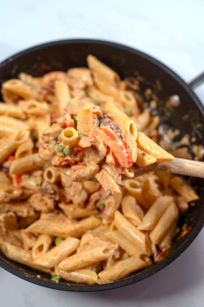 Closeup of a large spoon with Chicken Chipotle Pasta.