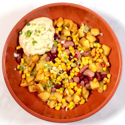 Fresh scallions are used to garnish Potato Bowl.