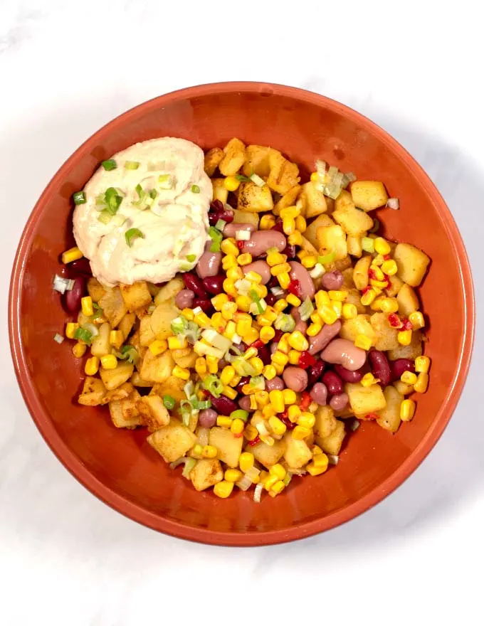 Fresh scallions are used to garnish Potato Bowl.