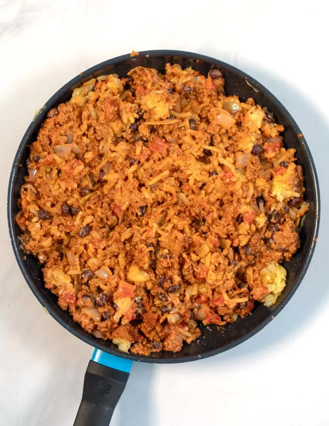 Top view of a large pan with taco hash brown casserole.