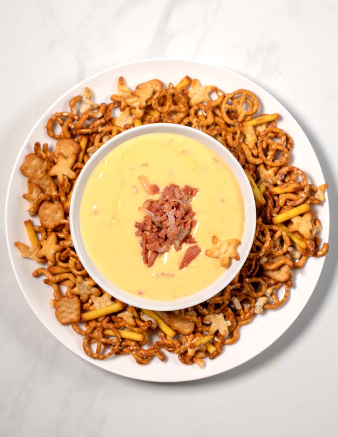 Serving of Beer Cheese Dip with pretzels.