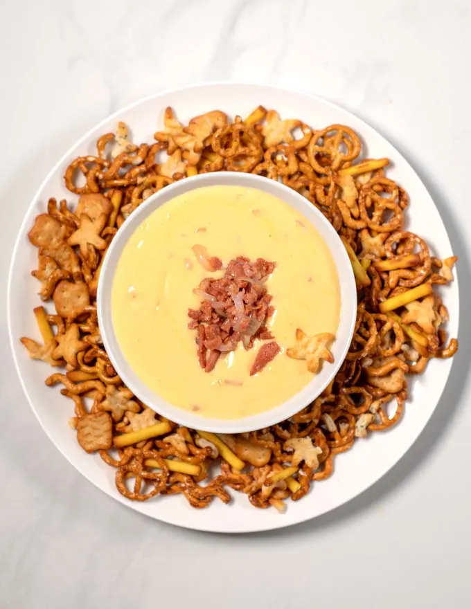 Serving of Beer Cheese Dip with pretzels.