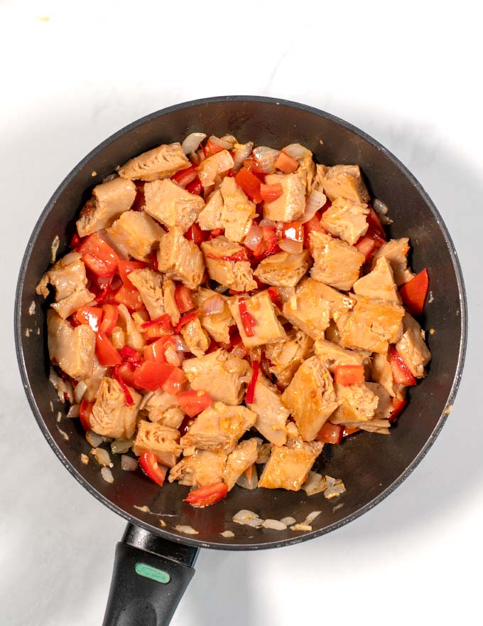 View of spiced chicken after frying in the pan. 