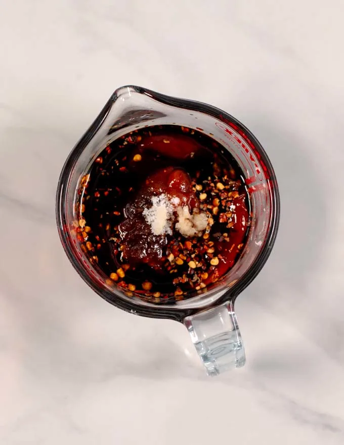 View of a small mixing bowl with the Pad Thai Sauce ingredients.