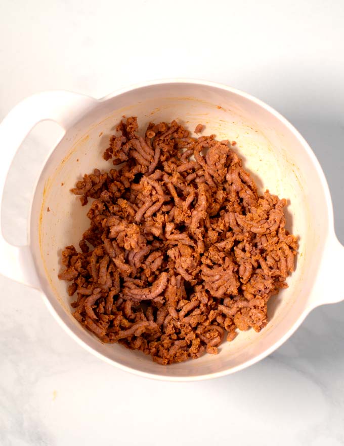 View of a white mixing bowl after combining all ingredients.