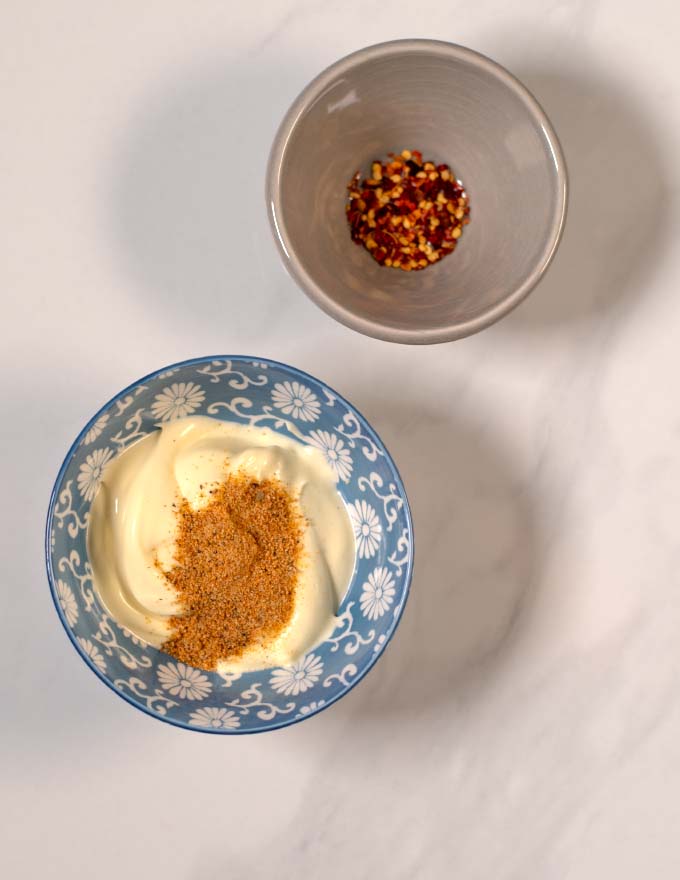 Step-by-step visual guide showing mixing of Cajun seasoning with plain mayo.