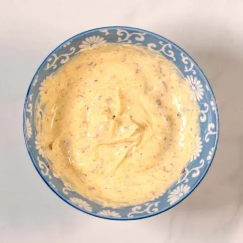 Top view on a mixing bowl with with mixed Spicy Mayo.