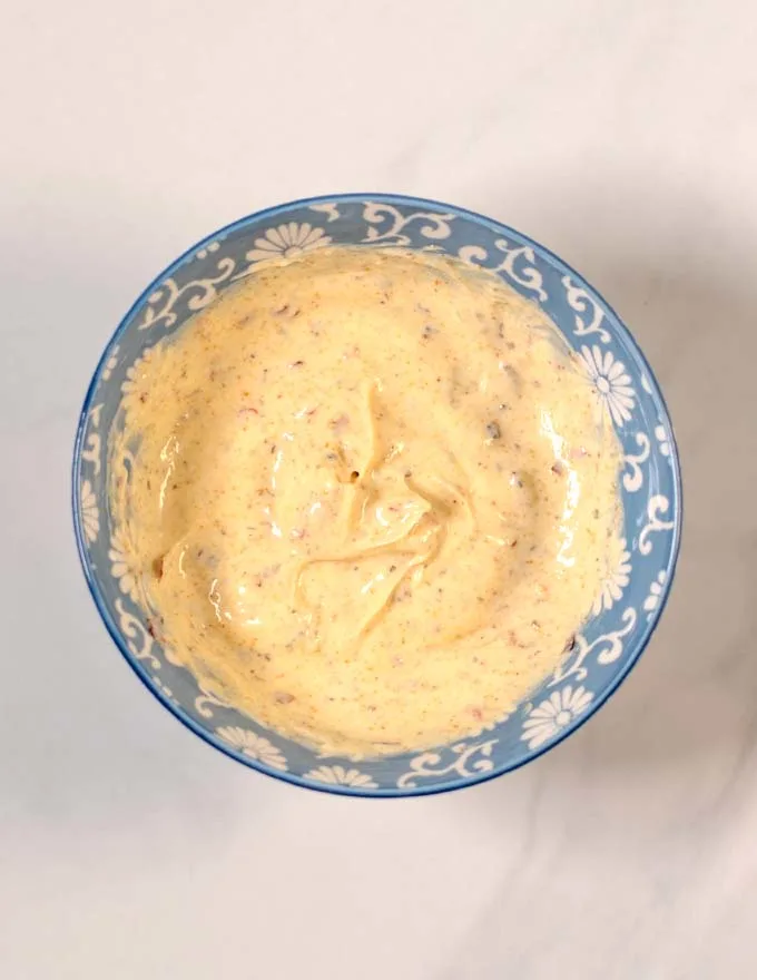 Top view on a mixing bowl with with mixed Spicy Mayo.