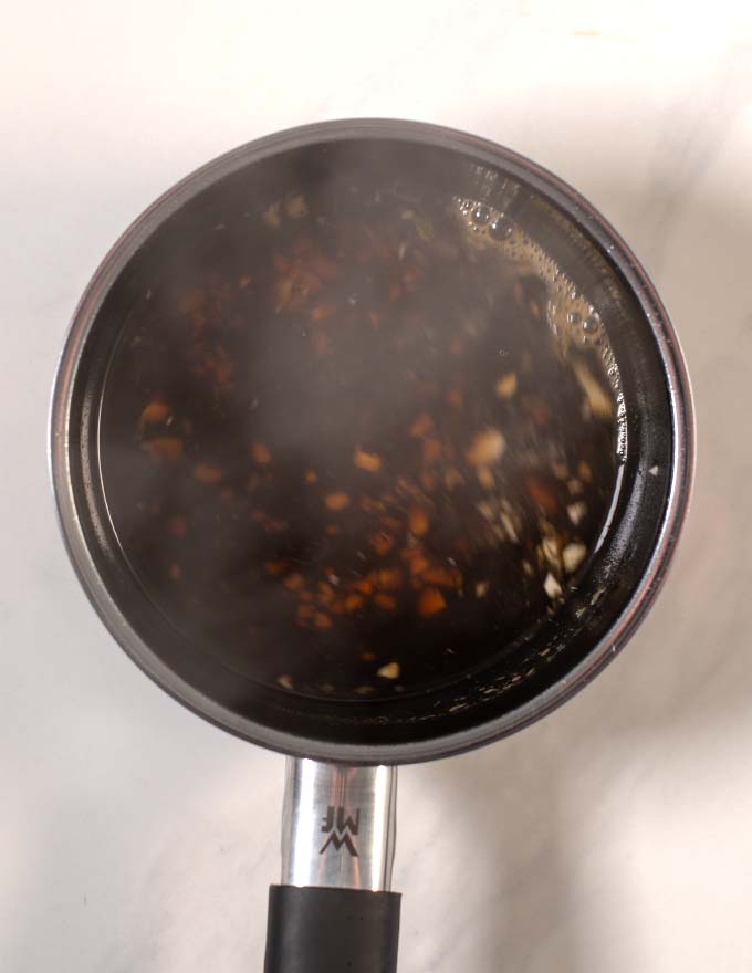 Top view of a small saucepan with the cooked Thai Brown Sauce.