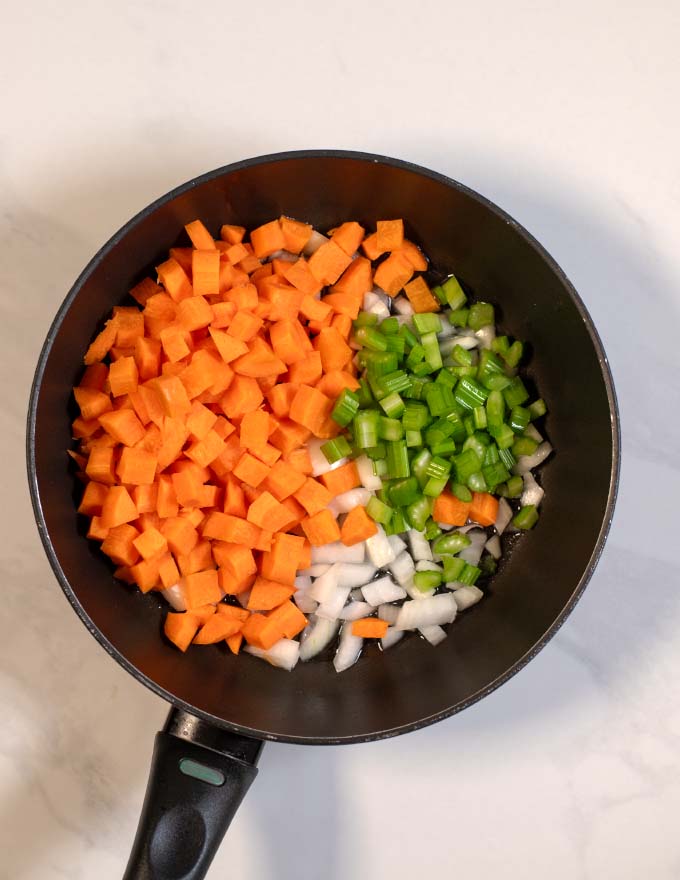 View of a pan with soffritto ingredients. 