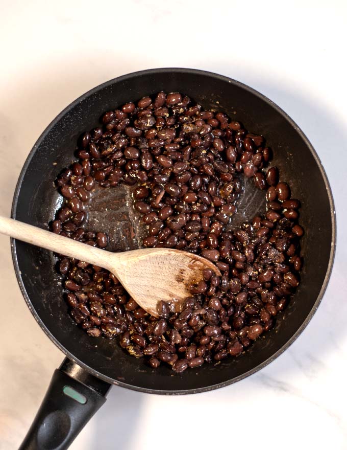 View of a pan with seasoned black bean topping.