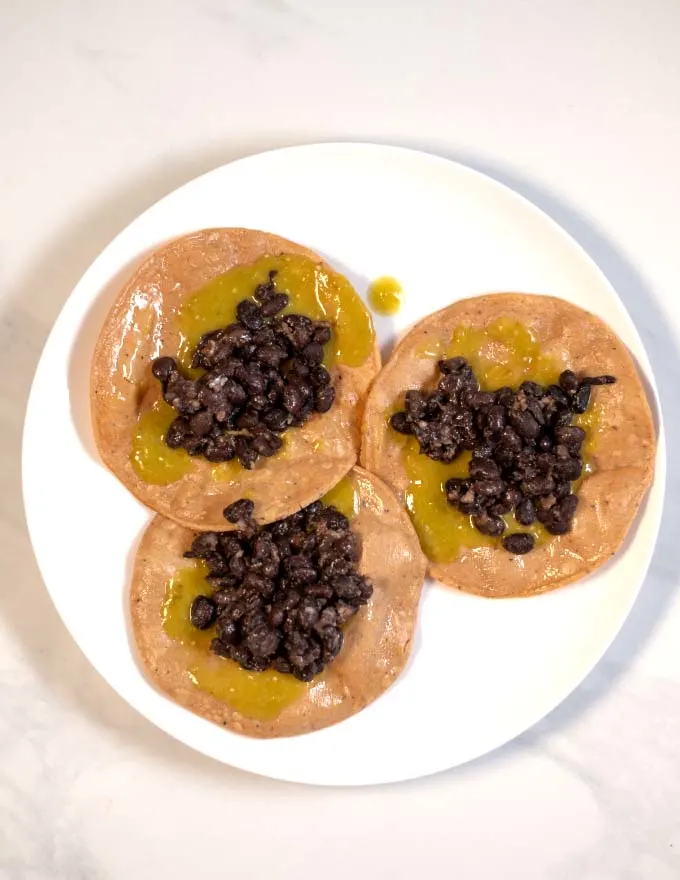 Black bean mixture is added to the Chalupas.