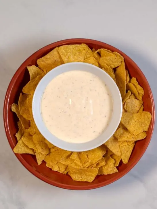 Serving of Mexican White Sauce with chips.