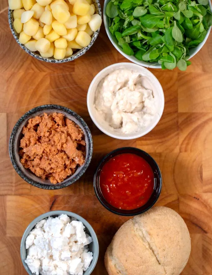 Ingredients needed to make Pambazos on a board.