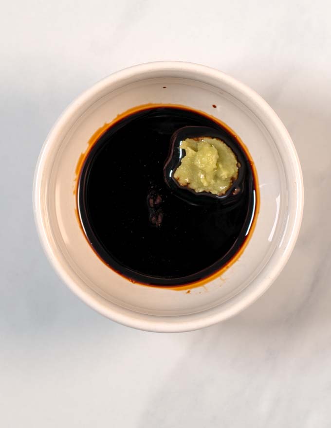 A mixing bowl showing the stir fry sauce before mixing.