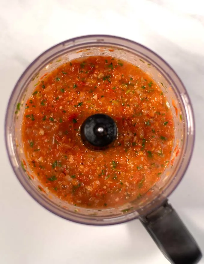 Salsa Roja in the bowl of a food processor after blending.