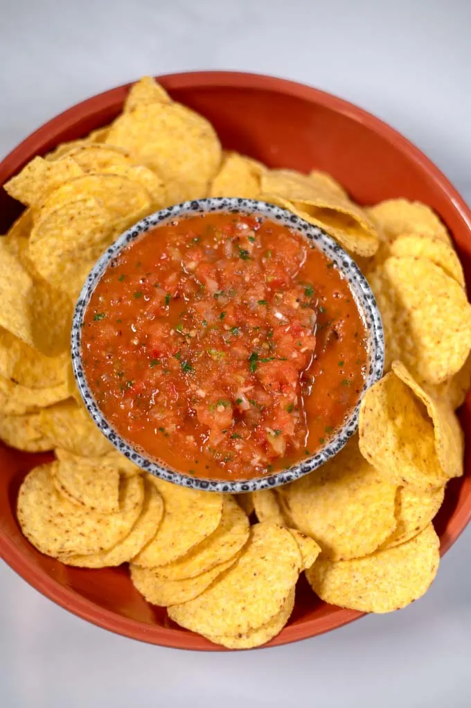 Closeup on a small serving bowl of Salsa Roja.