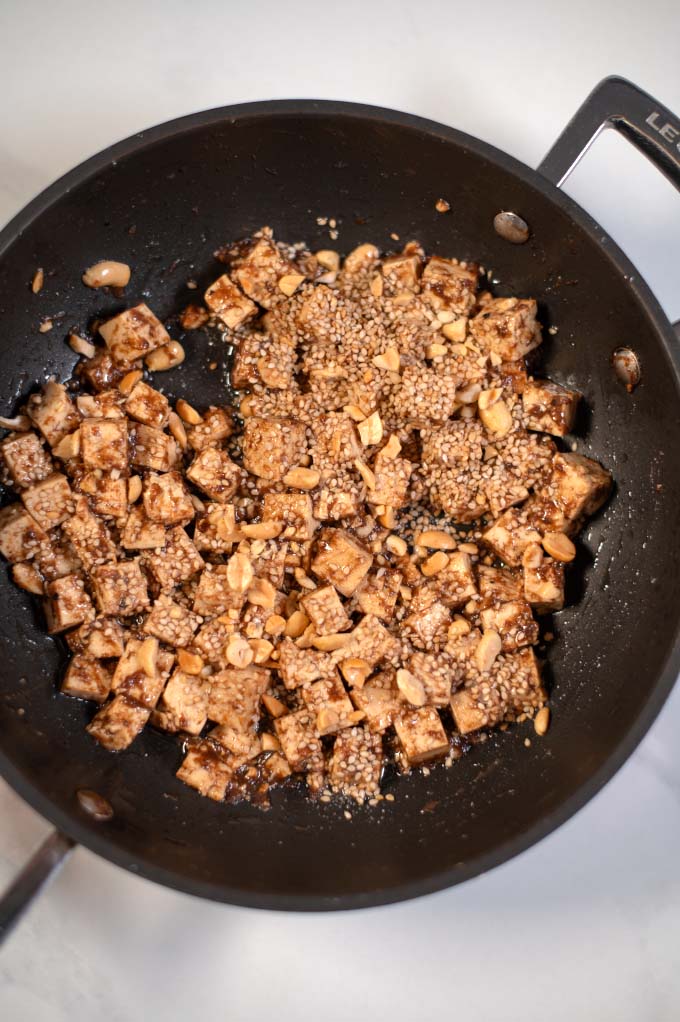 Fried tofu with tamarind sauce in a pan.