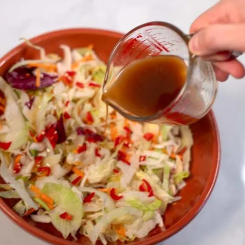 Thai Ginger Dressing is poured over a crunchy salad.