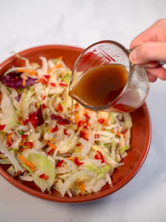 Thai Ginger Dressing is poured over a crunchy salad.