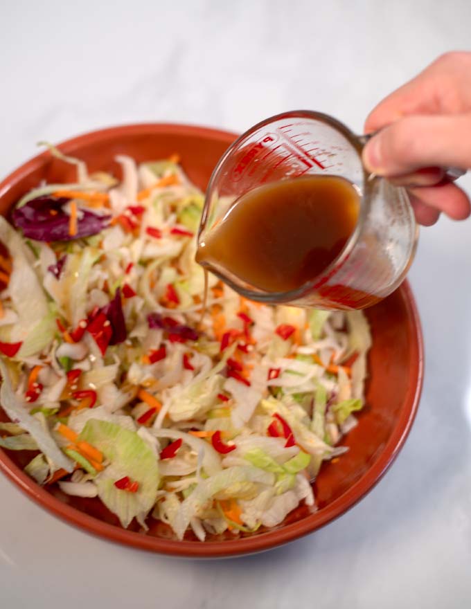 Thai Ginger Dressing is poured over a crunchy salad.