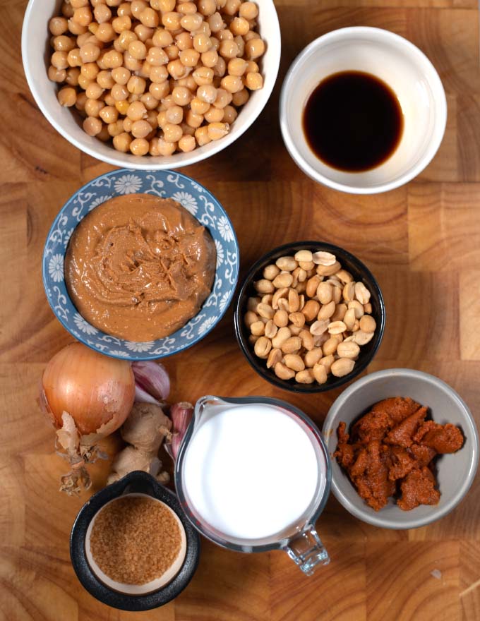 Ingredients needed to make Thai Peanut Curry on a board.