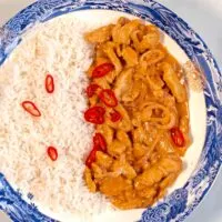 A serving of Thai Red Curry with white rice.