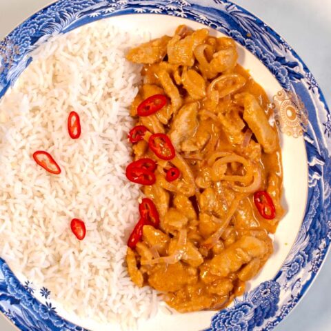 A serving of Thai Red Curry with white rice.