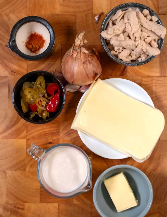 Ingredients needed to make Pollo Fundido on a board.