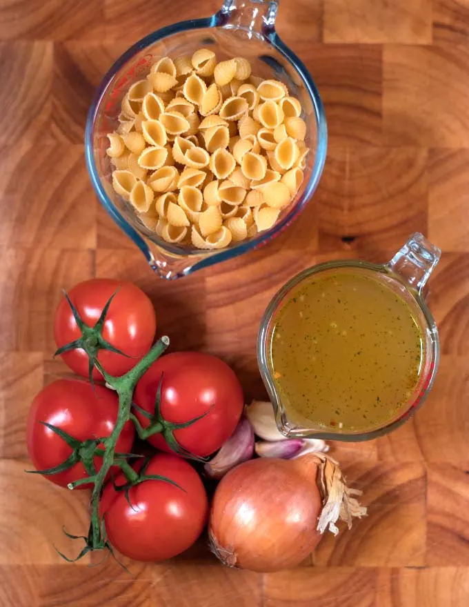 Ingredients needed to make Sopa de Conchas on a board.