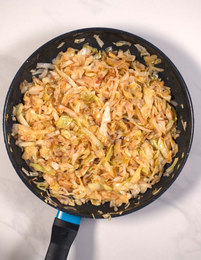 Ready Cabbage and Onion in a pan.