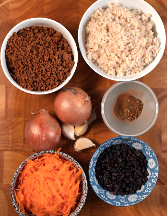 Ingredients needed to make Kabuli Pulao are collected on a board.