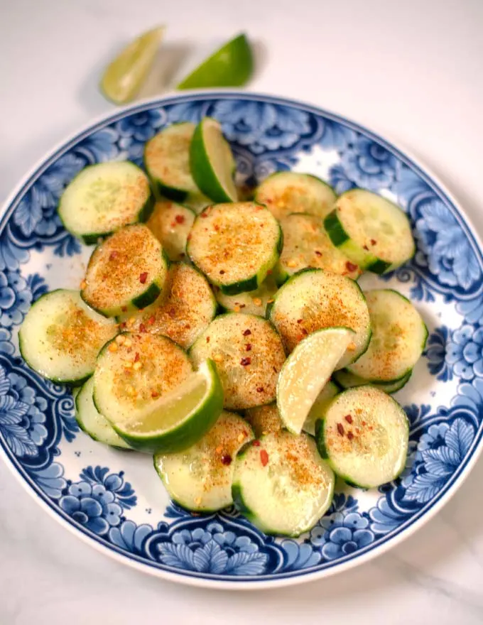 Lime wedges are served with Mexican Cucmber.