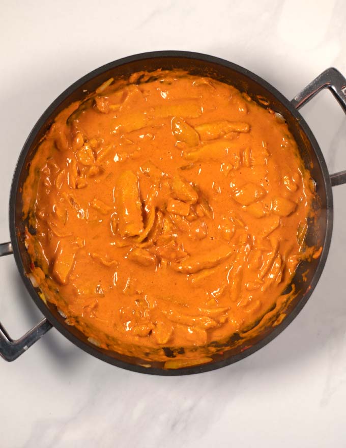 Top view of creamy Indian Curry in a pan.