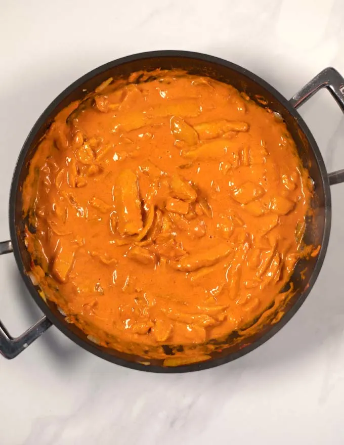 Top view of creamy Indian Curry in a pan.