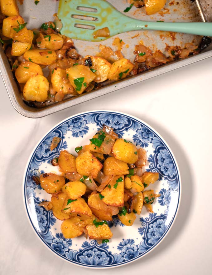 A serving of oven-roasted potatoes and onions.